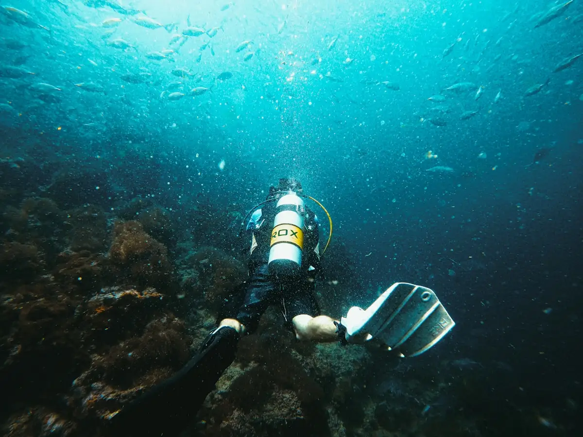 Scuba diver exploring clear blue water in Bali